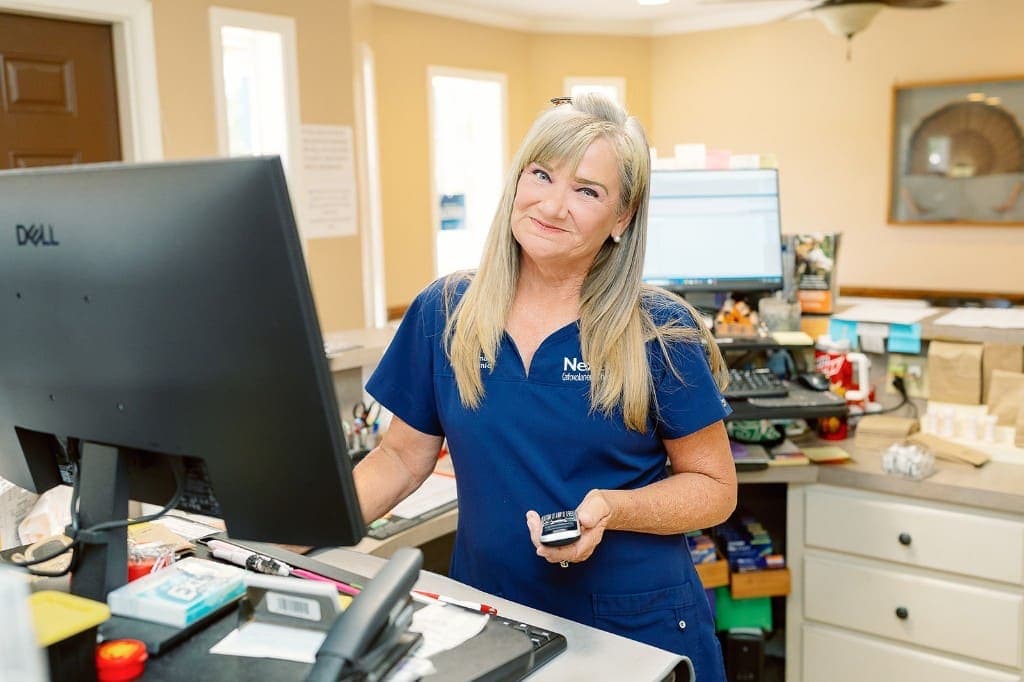 Friendly staff member at the front desk of Roberts Small Animal Clinic