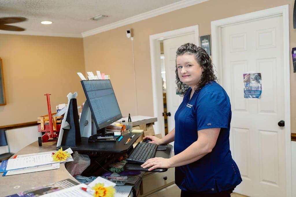 Front desk team member at Roberts Small Animal Clinic ready to help